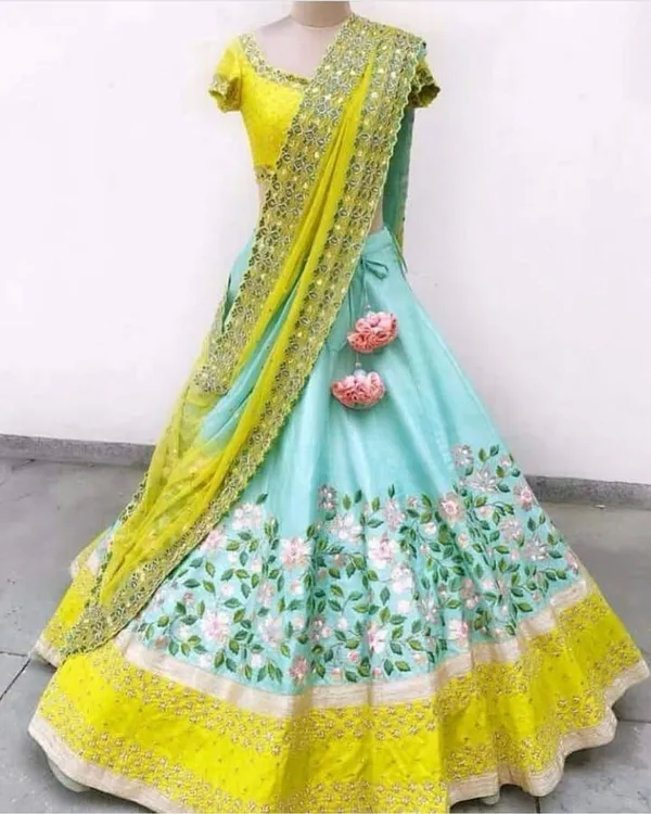 https://d1311wbk6unapo.cloudfront.net/NushopCatalogue/tr:f-webp,w-600,fo-auto/Aika Blue n Yellow Colored silk Lehengha Choli With Embrodariy Work -LC 13_37MO5IPSNJ_2022-02-11_1.jpg__Aika Fashion